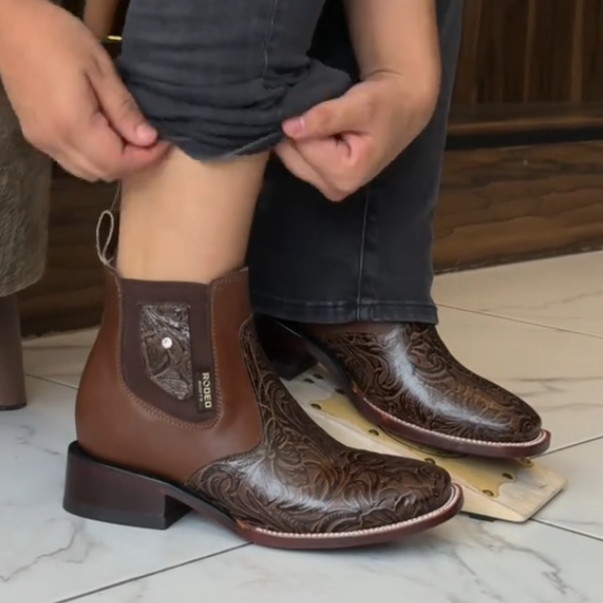 Western-style carved cowboy boots